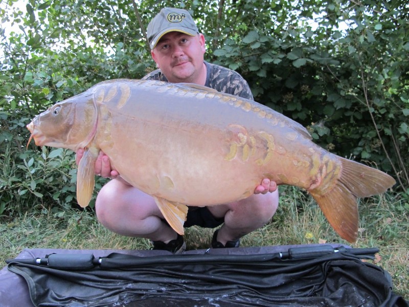 Danny with a 40lb02oz mirror that he's named Em's
