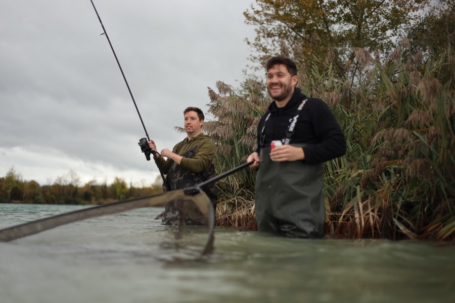 Net in one hand, beer in the other